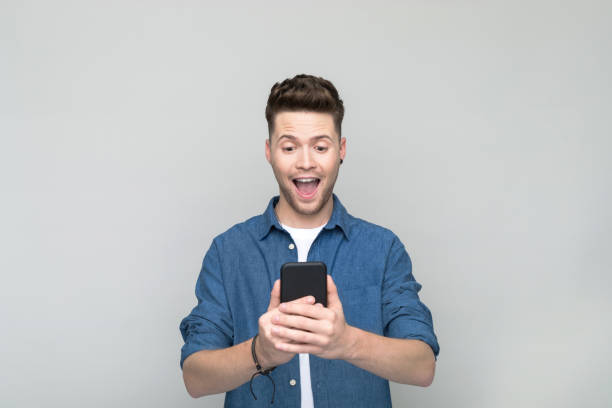 istock Portrait of young man using smart phone 1500576026