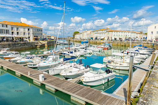 The marina at St Helier, the capital of Jersey. Logos and names removed from boats. Any flags are nautical standards or country identifications.