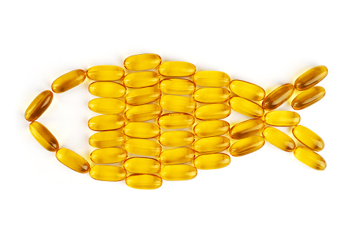 Fish oil capsules isolated on white background.