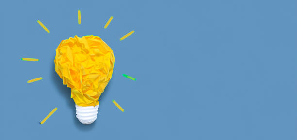 istock yellow light bulb. idea concept on blue background 1500600118