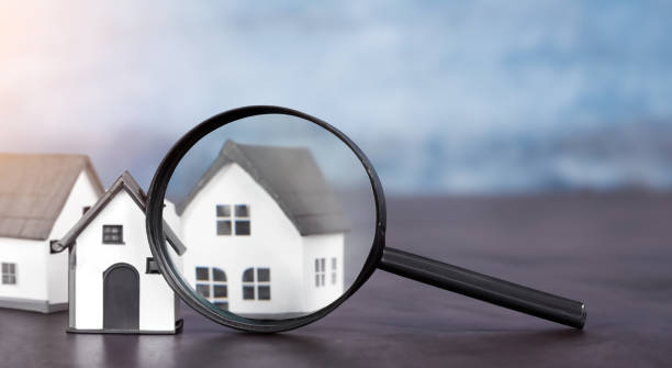 istock magnifying glass showing a house. home buying concept 1500600968