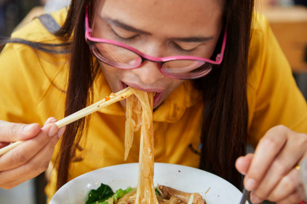 istock Asian women eating noodles 1500605780