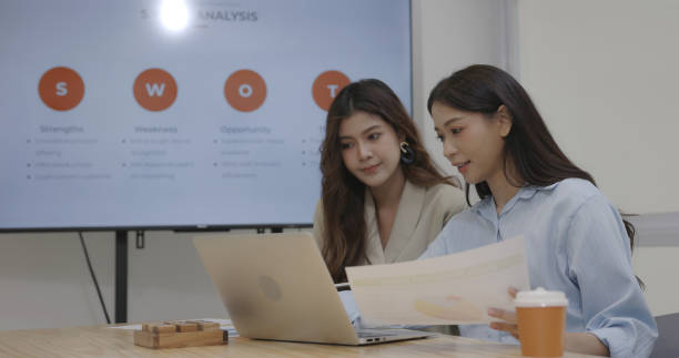 istock Businesswoman presenting project goal setting strategy at work for colleague in conference room. Event planning for successful business expansion 1500609239