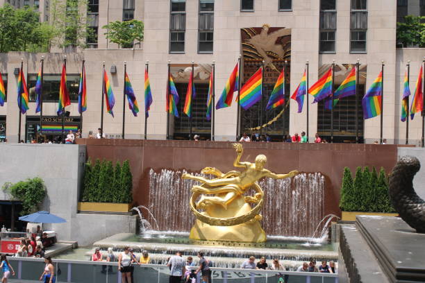 Rainbow Rockefeller Rockefeller Center Plaza decked out in rainbow flags, in celebration of pride, diversity and inclusiveness rockefeller ice rink stock pictures, royalty-free photos & images