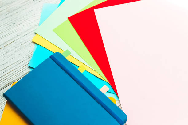 istock Notebook diary for planning in blue and yellow and colored cardboard for creativity 1500615437