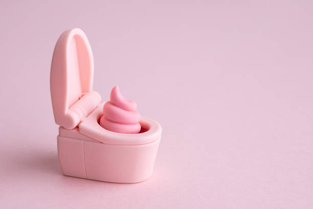 istock cute poop and pink toilet 1500617137