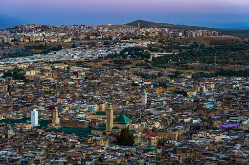 Morocco. Fez. View fron the hill above the old medina in Fez at dusk. At the center the Karaouiyine mosque