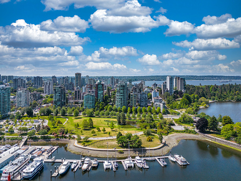 False Creek, Downtown Vancouver, British Columbia, Canada. Beautiful Aerial View of a Modern City on the West Pacific Coast during a colorful Sunset. Sky Composite