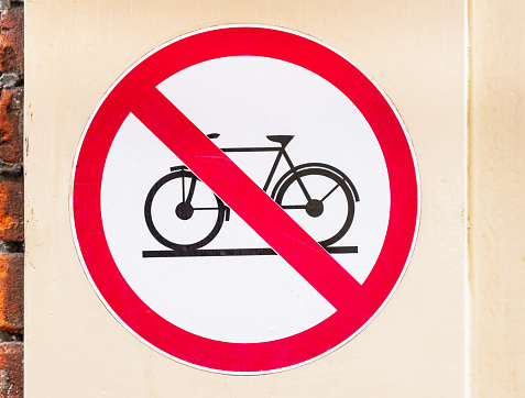 Close-up of a simple sign, indicating that bicycles are forbidden, on a street in Amsterdam.