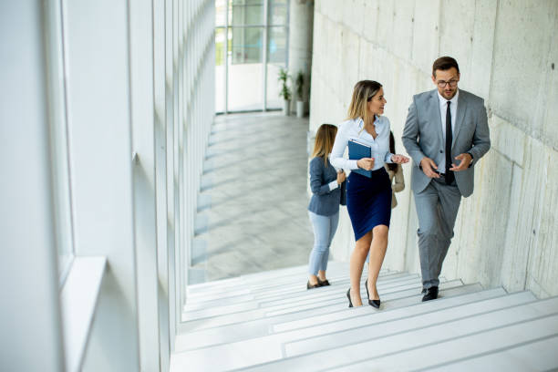 istock Young startup team have a discussion while climbing on  stairs in the office corridor 1500622234