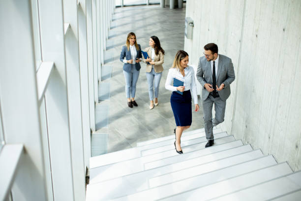 istock Young startup team have a discussion while climbing on  stairs in the office corridor 1500622572