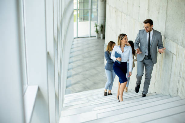 istock Young startup team have a discussion while climbing on  stairs in the office corridor 1500622579