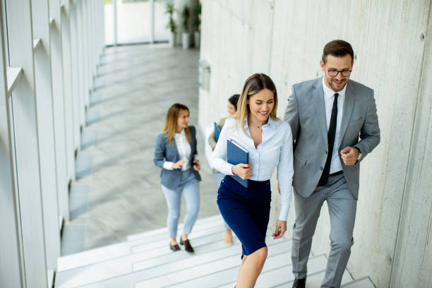 istock Young startup team have a discussion while climbing on  stairs in the office corridor 1500622588