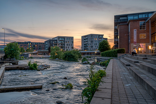 streaming water in the center of Silkeborg town in the evening light, Denmark, June 16, 2023