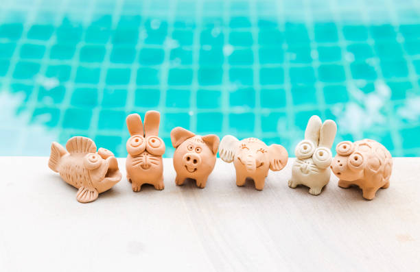 istock Animal clay sculpture collections on swimming pool edge 1500624719
