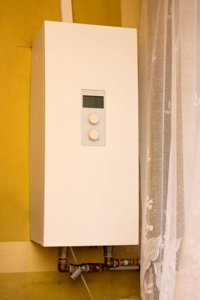 istock White gas stove hanging on the wall. Rustic home interior. 1500626189