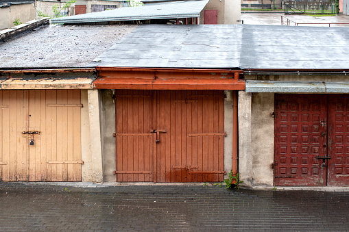 Old garages for car with wooden doors in outdoor.
