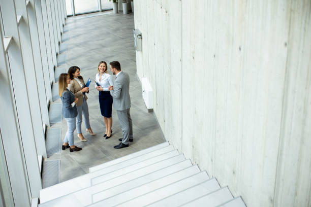 istock Young startup team have a discussion by stairs in the office corridor 1500626437