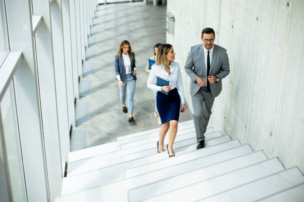 istock Young startup team have a discussion while climbing on  stairs in the office corridor 1500626438