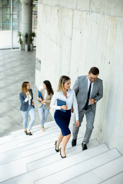 istock Young startup team have a discussion while climbing on  stairs in the office corridor 1500626449