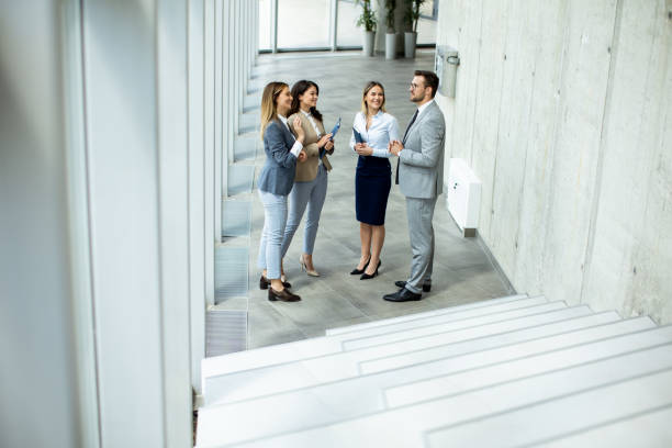 istock Young startup team have a discussion by stairs in the office corridor 1500626471