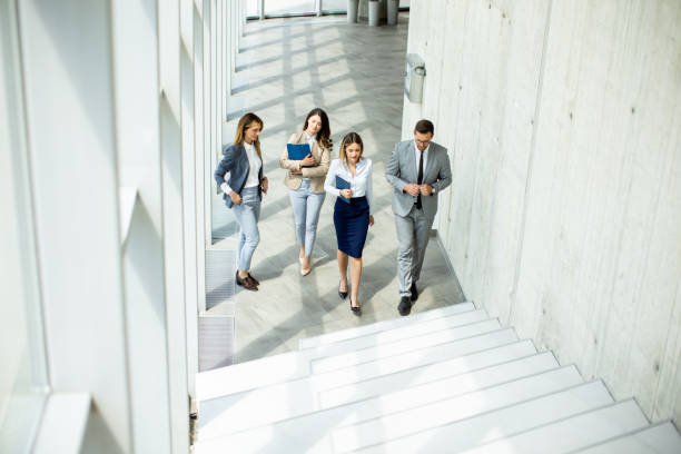 istock Young startup team have a discussion while climbing on  stairs in the office corridor 1500626563