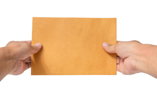 istock Man's hand holding envelope isolated on white background. Close up. High resolution product 1500627565