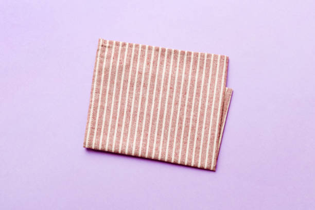 istock top view with red empty kitchen napkin isolated on table background. Folded cloth for mockup with copy space, Flat lay. Minimal style 1500627613