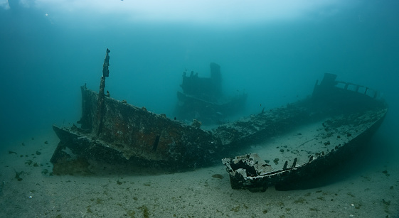 Old shipwreck about coast of Kunashir island, Kurils islands, gloomy weather