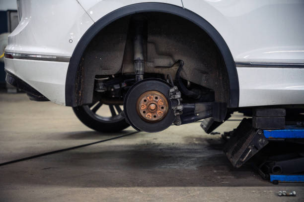 istock SUV on the car lift in auto service, without wheels 1500638842
