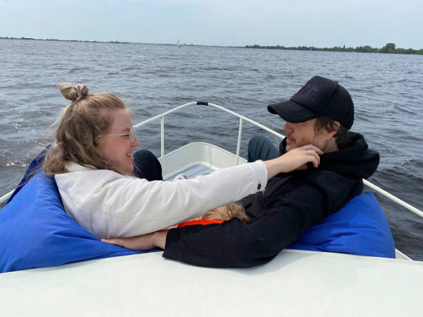 istock Relaxing sailing young couple on boat 1500640152