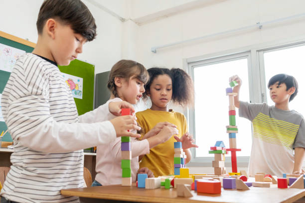 istock Diversity School kids playing wooden toy blocks 1500641673