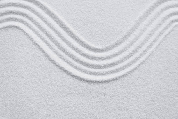istock Japanese zen garden with line pattern in white sand, Sand texture with the wave parallel lines pattern,Harmony,Meditation,Zen like concept 1500643707