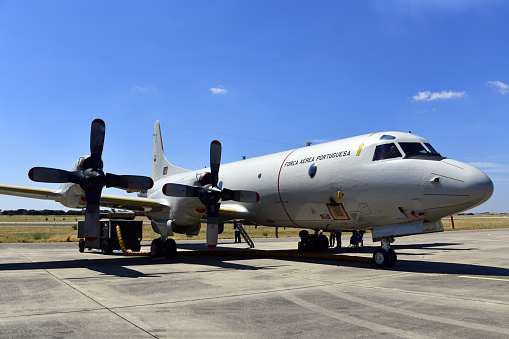 Beja, Portugal: parked Lockheed P-3 Orion, a four-engine, propeller-driven aircraft used as a maritime patrol and anti-submarine warfare aircraft. The P-3 Orion is a military derivative of the Lockheed L-188 Electra civil aircraft. Due to the Azores and Madeira archipelagos, Portugal controls a vast Exclusive Economic Zone (EEZ) in the Atlantic Ocean. Beja Airport serves both civil and military aviation.