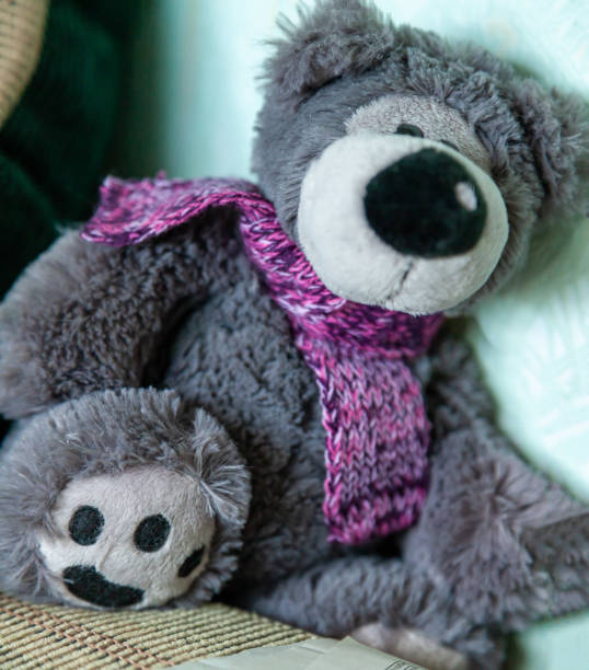 istock Teddy bear with a knitted scarf 1500650928