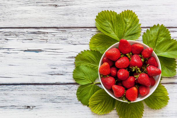istock Ripe red strawberries in a white cup 1500653974
