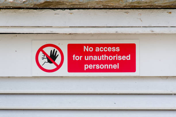 istock Strictly no unauthorised access sign at construction site security door 1500654132
