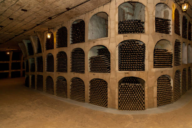 istock Old bottles of wine stacked in rows 1500654301