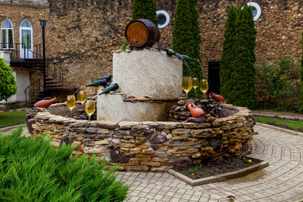 istock Fountain with white wine pouring from bottles 1500654897