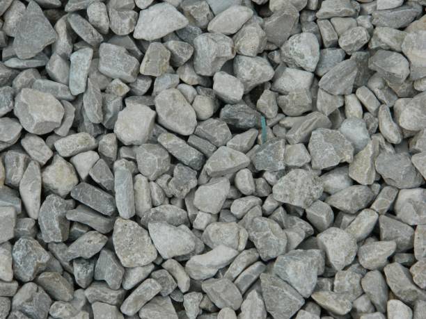 istock Light blue and white gravel texture background featuring large rocks 1500655514