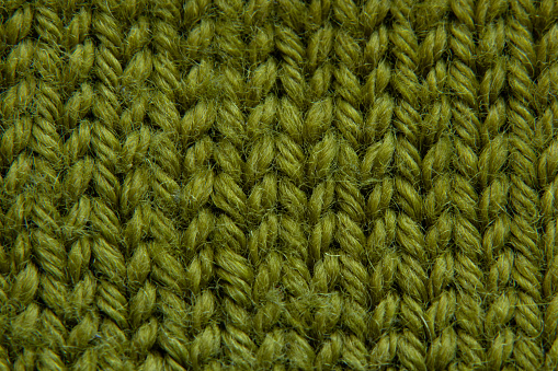 knitted green fabric sweaters closeup