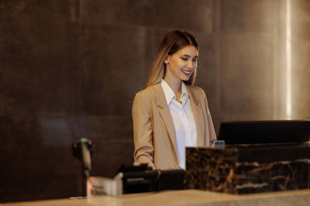 istock Portrait of young hotel receptionist behind counter 1500655694