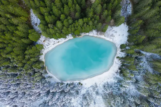 Mystical shot of beautiful Switzerland taken with a drone. Great light conditions in the Swiss Alps whether in winter or in summer. The forests and lakes of Switzerland enchant.