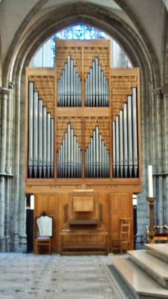 the oak & steel choir organ was created by patrick collon in 1977.