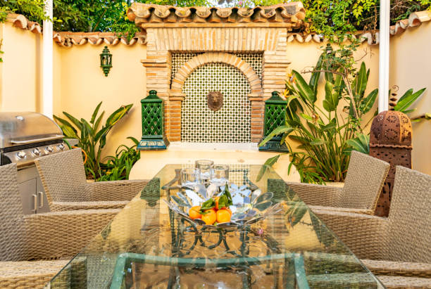 istock Close up glass table with walled water feature background 1500659477