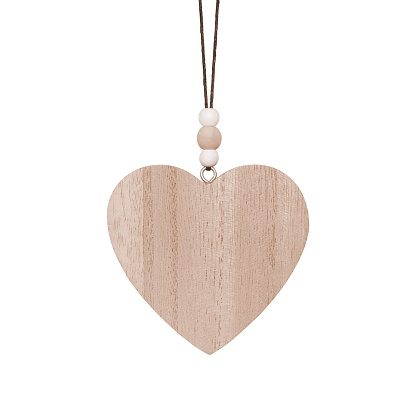 Hanging brown wooden heart. Christmas ornament isolated on a white background. Stock photography