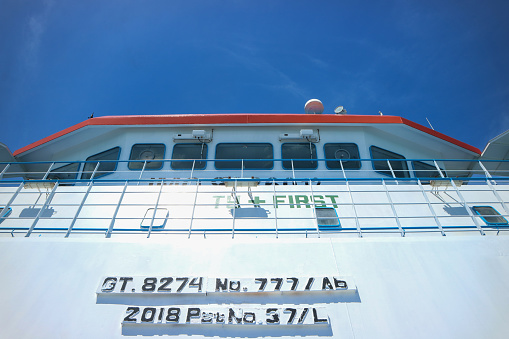 Surakarta, Indonesia - May 16, 2023: Front view of the navigation cabine on a passenger ship againts clear blue sky background.