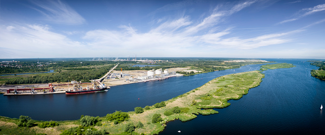 Gas terminal with a quay at the Odra River in Police. On the side of the Odra River, tanks for two types of gas and a wharf for receiving gas carriers were built