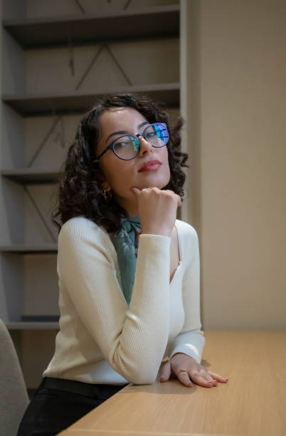 istock Young beautiful woman in the library 1500666614