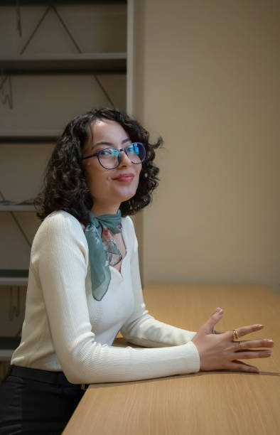 istock Young beautiful woman in the library 1500667209